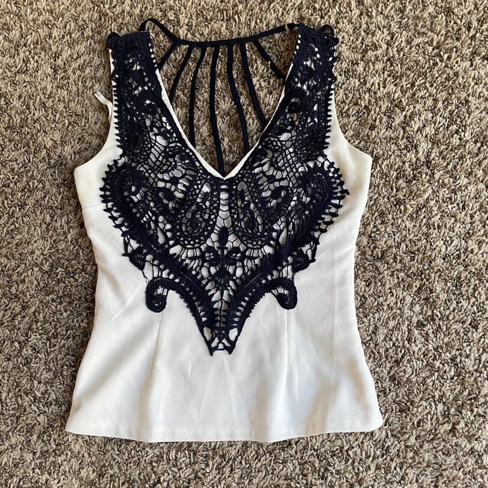 White with embroidered blue detail